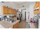 Kitchen with wood cabinets and standard appliances at 4372 Odin St, Spring Hill, FL 34608