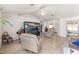 Spacious living room featuring a large TV and comfortable seating at 4372 Odin St, Spring Hill, FL 34608