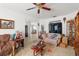 Living room with multiple seating areas and a view to another room at 4372 Odin St, Spring Hill, FL 34608