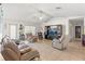 Spacious living room with vaulted ceiling, tiled floor, and comfy leather furniture at 4372 Odin St, Spring Hill, FL 34608