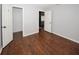 Simple bedroom with wood flooring and neutral walls at 4649 Westerly Dr, New Port Richey, FL 34653
