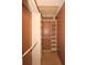 Large walk-in closet with shelving and hanging rods at 4649 Westerly Dr, New Port Richey, FL 34653