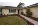 House entrance with walkway and landscaping at 4649 Westerly Dr, New Port Richey, FL 34653