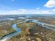 Aerial view of a beautiful waterfront property and surrounding area at 5287 Tuna Ln, Weeki Wachee, FL 34607