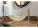 Modern bathroom featuring a glass vessel sink and sleek faucet at 5287 Tuna Ln, Weeki Wachee, FL 34607