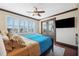 Comfortable bedroom with king-size bed and private balcony at 5287 Tuna Ln, Weeki Wachee, FL 34607