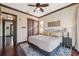 Bright bedroom with king-size bed and access to hallway at 5287 Tuna Ln, Weeki Wachee, FL 34607