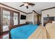 King-size bed, private balcony, and en-suite bathroom at 5287 Tuna Ln, Weeki Wachee, FL 34607