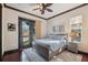 Bright bedroom with a comfortable bed and access to a balcony at 5287 Tuna Ln, Weeki Wachee, FL 34607