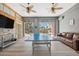Game room with ping pong table, leather couch, and water views at 5287 Tuna Ln, Weeki Wachee, FL 34607