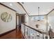 Elegant hallway with hardwood floors and access to bedrooms at 5287 Tuna Ln, Weeki Wachee, FL 34607