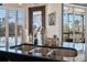 Modern kitchen with double sink and granite countertops; view to balcony at 5287 Tuna Ln, Weeki Wachee, FL 34607