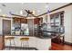 Modern kitchen with dark wood cabinets, granite countertops, and stainless steel appliances at 5287 Tuna Ln, Weeki Wachee, FL 34607