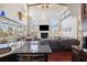 Open floor plan showing kitchen island and living room with fireplace and water view at 5287 Tuna Ln, Weeki Wachee, FL 34607
