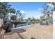 Brick patio with waterfront views, grill, and seating at 5287 Tuna Ln, Weeki Wachee, FL 34607