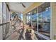 Relaxing screened porch with wicker furniture and water views at 5287 Tuna Ln, Weeki Wachee, FL 34607
