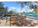 Outdoor dining area on waterfront patio with water views at 5287 Tuna Ln, Weeki Wachee, FL 34607