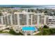 Aerial view of building, pool, and waterfront at 5915 Sea Ranch Dr # 501, Hudson, FL 34667