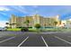 Building exterior with parking and tennis courts at 5915 Sea Ranch Dr # 501, Hudson, FL 34667
