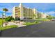 Building exterior with parking and seating area at 5915 Sea Ranch Dr # 501, Hudson, FL 34667