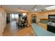 Kitchen boasts light wood cabinets, teal countertops, and modern appliances at 5915 Sea Ranch Dr # 501, Hudson, FL 34667