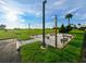 Relaxing outdoor seating area with string lights and benches at 5915 Sea Ranch Dr # 501, Hudson, FL 34667