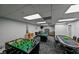 Game room with foosball, pool table, and card table at 5915 Sea Ranch Dr # 501, Hudson, FL 34667