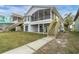 Landscaped backyard with walkway leading to the water at 5925 Seaside Dr, New Port Richey, FL 34652