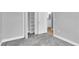 Spacious bedroom with gray walls, new carpet, and built in shelving at 5925 Seaside Dr, New Port Richey, FL 34652
