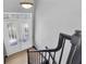 Bright entryway with double doors and elegant staircase at 5925 Seaside Dr, New Port Richey, FL 34652