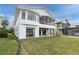 Two-story home with large screened porch, backyard, and dock access at 5925 Seaside Dr, New Port Richey, FL 34652