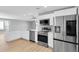 Modern kitchen with stainless steel appliances and white cabinets at 5925 Seaside Dr, New Port Richey, FL 34652