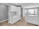 Bright kitchen boasts white cabinets and ample counter space at 5925 Seaside Dr, New Port Richey, FL 34652