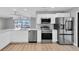 Updated kitchen featuring stainless steel appliances and water view at 5925 Seaside Dr, New Port Richey, FL 34652