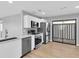 Modern kitchen with stainless steel appliances and white shaker cabinets at 5925 Seaside Dr, New Port Richey, FL 34652
