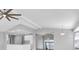 Open concept living area with high ceilings and ceiling fan at 5925 Seaside Dr, New Port Richey, FL 34652