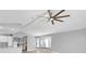 Open and airy living room with vaulted ceiling and large windows at 5925 Seaside Dr, New Port Richey, FL 34652