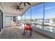 Relaxing screened porch with wooden deck and water views at 5925 Seaside Dr, New Port Richey, FL 34652