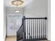 Elegant staircase with dark wood railings leading to the upper level at 5925 Seaside Dr, New Port Richey, FL 34652