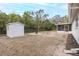 Storage shed and fire pit in backyard at 6166 Newmark St, Spring Hill, FL 34606