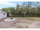 Spacious backyard with fire pit and chain link fence at 6166 Newmark St, Spring Hill, FL 34606