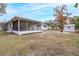 Screened porch and storage shed in yard at 6166 Newmark St, Spring Hill, FL 34606