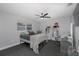 Spacious bedroom with a double bed, desk, and ceiling fan at 6166 Newmark St, Spring Hill, FL 34606