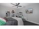 Bedroom with double bed, dresser, and large TV at 6166 Newmark St, Spring Hill, FL 34606