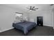 Cozy bedroom featuring a safe and ceiling fan at 6166 Newmark St, Spring Hill, FL 34606