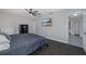 Spacious bedroom with ceiling fan and large TV at 6166 Newmark St, Spring Hill, FL 34606
