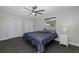 Well-lit bedroom with double closets and ceiling fan at 6166 Newmark St, Spring Hill, FL 34606