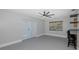 Bright and airy common area with French doors and ceiling fan at 6166 Newmark St, Spring Hill, FL 34606