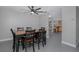 Dining room with view into kitchen, ceiling fan at 6166 Newmark St, Spring Hill, FL 34606