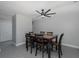 Dining area with wood table and black chairs, ceiling fan at 6166 Newmark St, Spring Hill, FL 34606